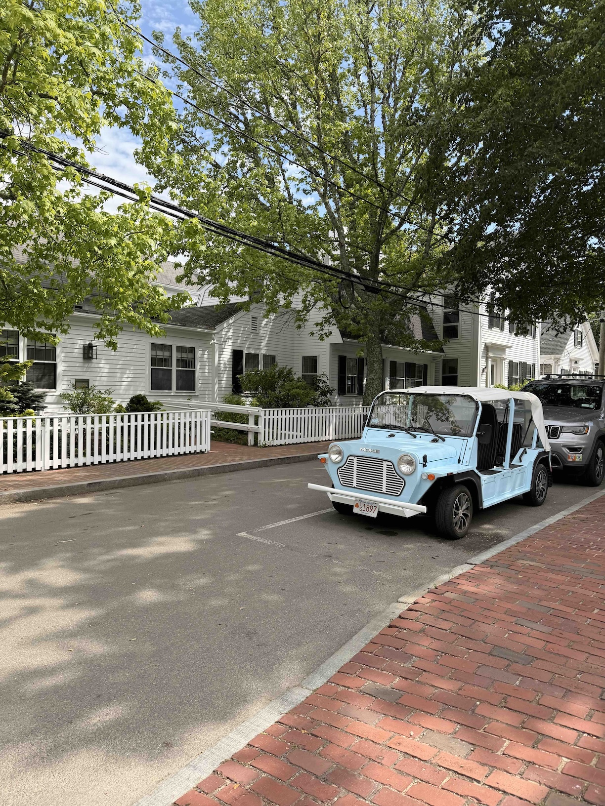 Martha's Vineyard Edgartown Street with eggshell blue car and brick sidewalks