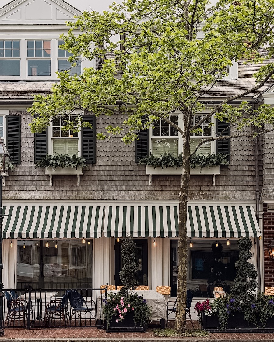 Martha's Vineyard downtown restaurant with outdoor seating and a striped awning