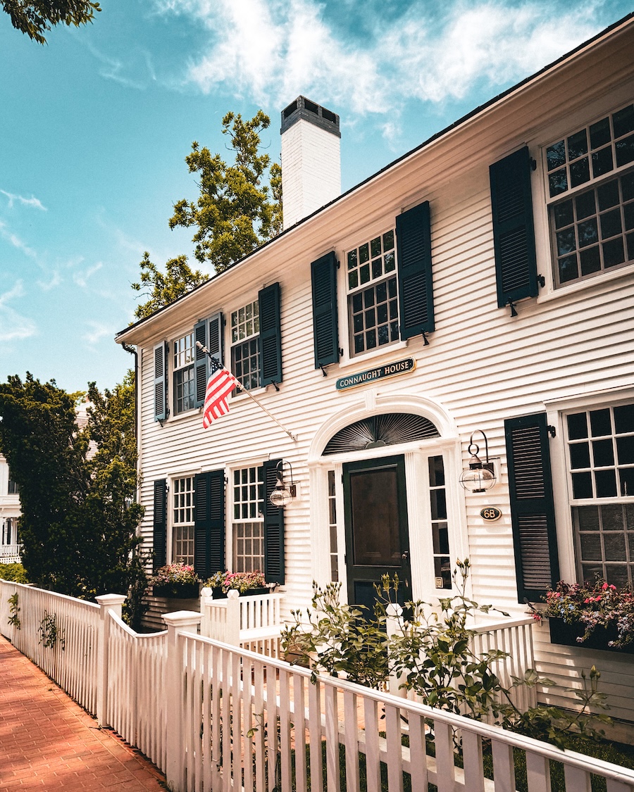 white house with shutters and a white picket fence in edgartown martha's vineyard